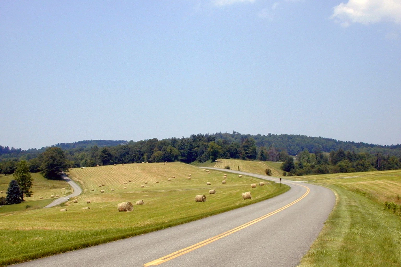 Blue Ridge forested countryside before an illustrative transmission corridor
